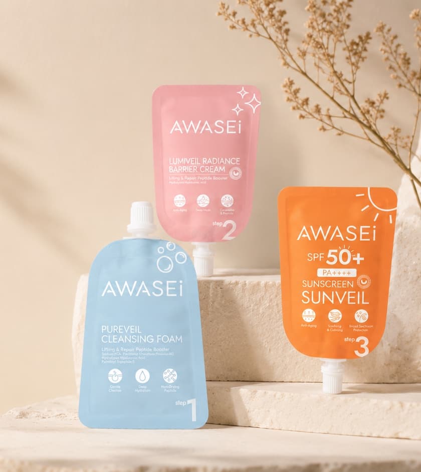 Three Awasei products arranged on ivory stone in gentle sunlight