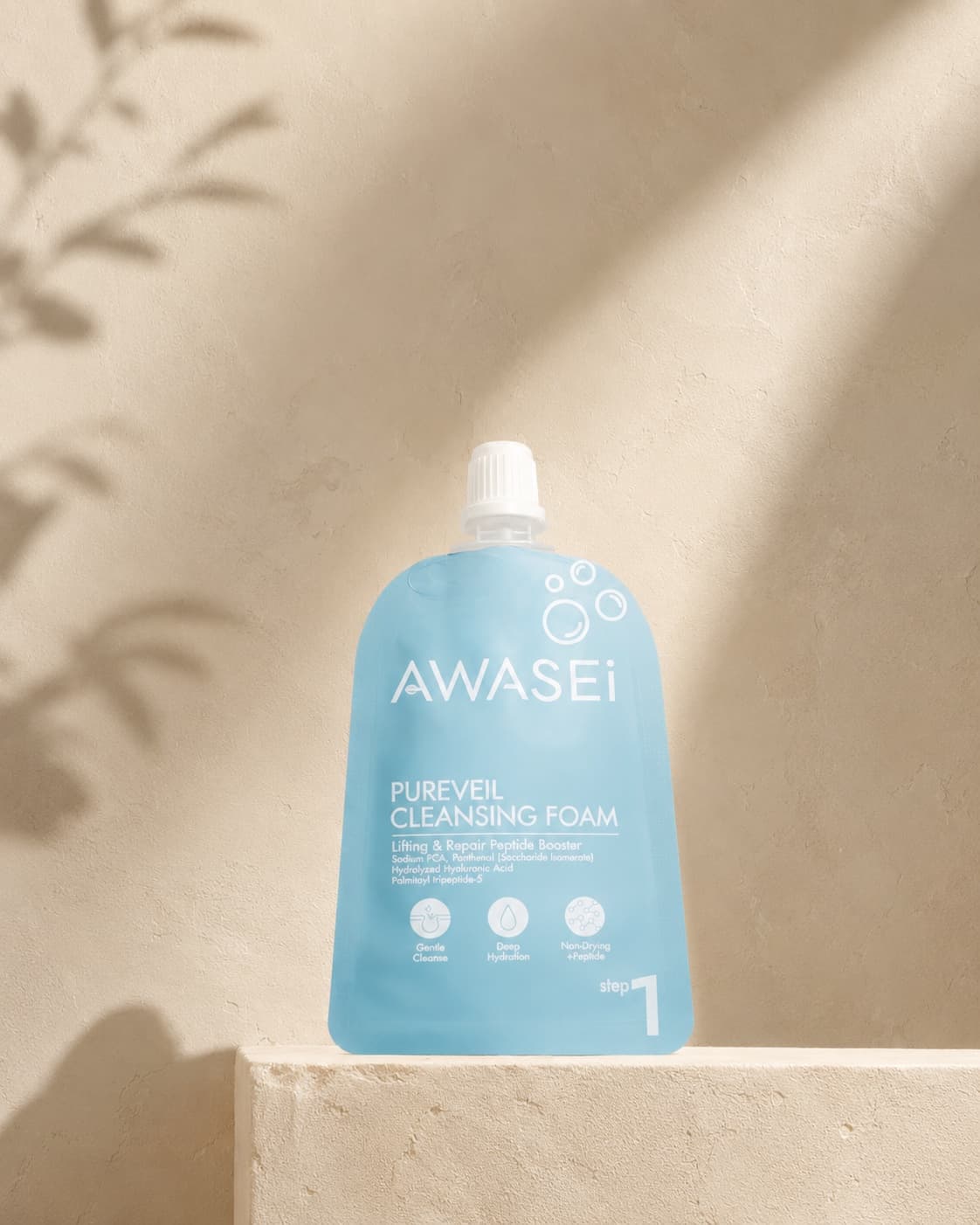 Awasei PUREVEIL cleansing foam on an ivory plaster shelf in soft light